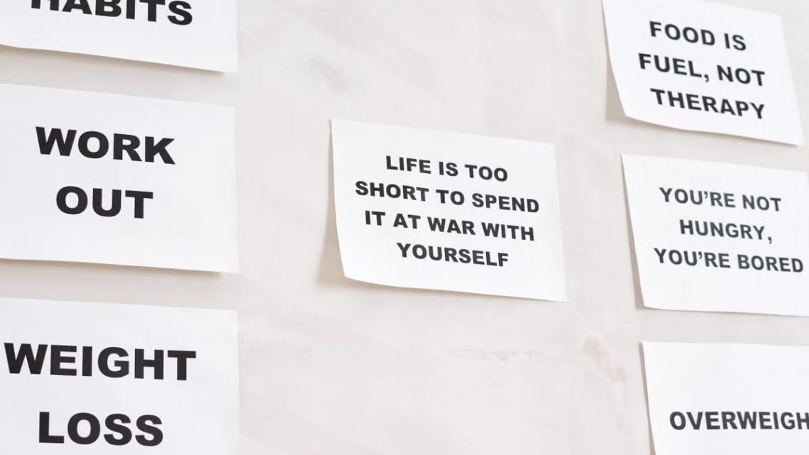 Motivational quotes on white paper promoting healthy habits and lifestyle changes.