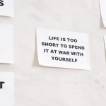 Motivational quotes on white paper promoting healthy habits and lifestyle changes.