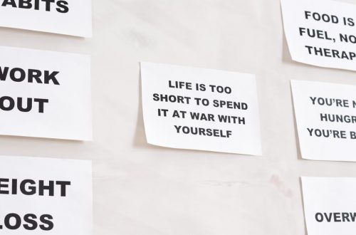 Motivational quotes on white paper promoting healthy habits and lifestyle changes.